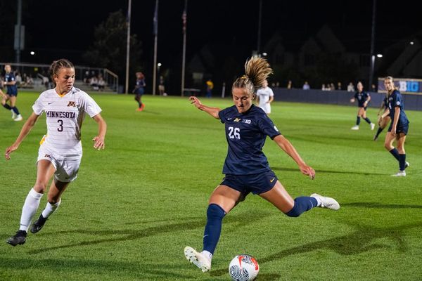 Michigan Women's Soccer player Jenna Lang winds up to shoot.