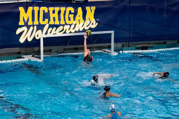 Water Polo Keeper Alex Brown tips an LIU shot over the net.