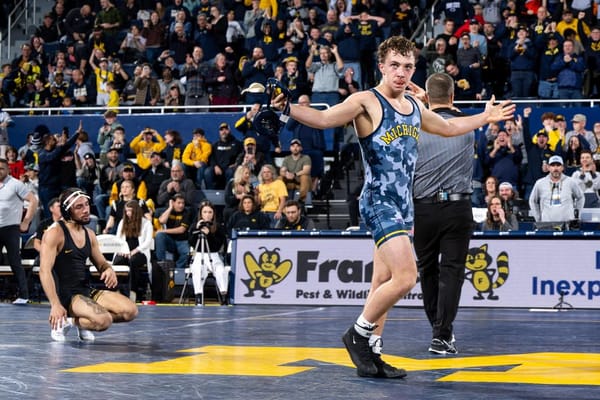 Wrestler Sergio Lemley hypes up the crowd following a big upset.