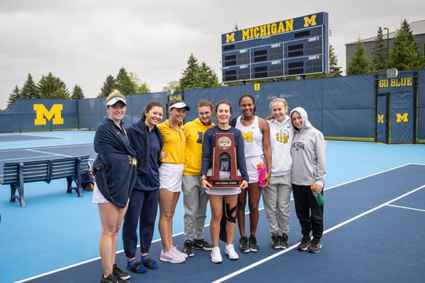 On an unseasonably cold day in Ann Arbor, Wolverine women's tennis celebrates punching their ticket to the quarterfinals.